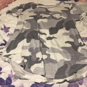A gray and white camo shirt.